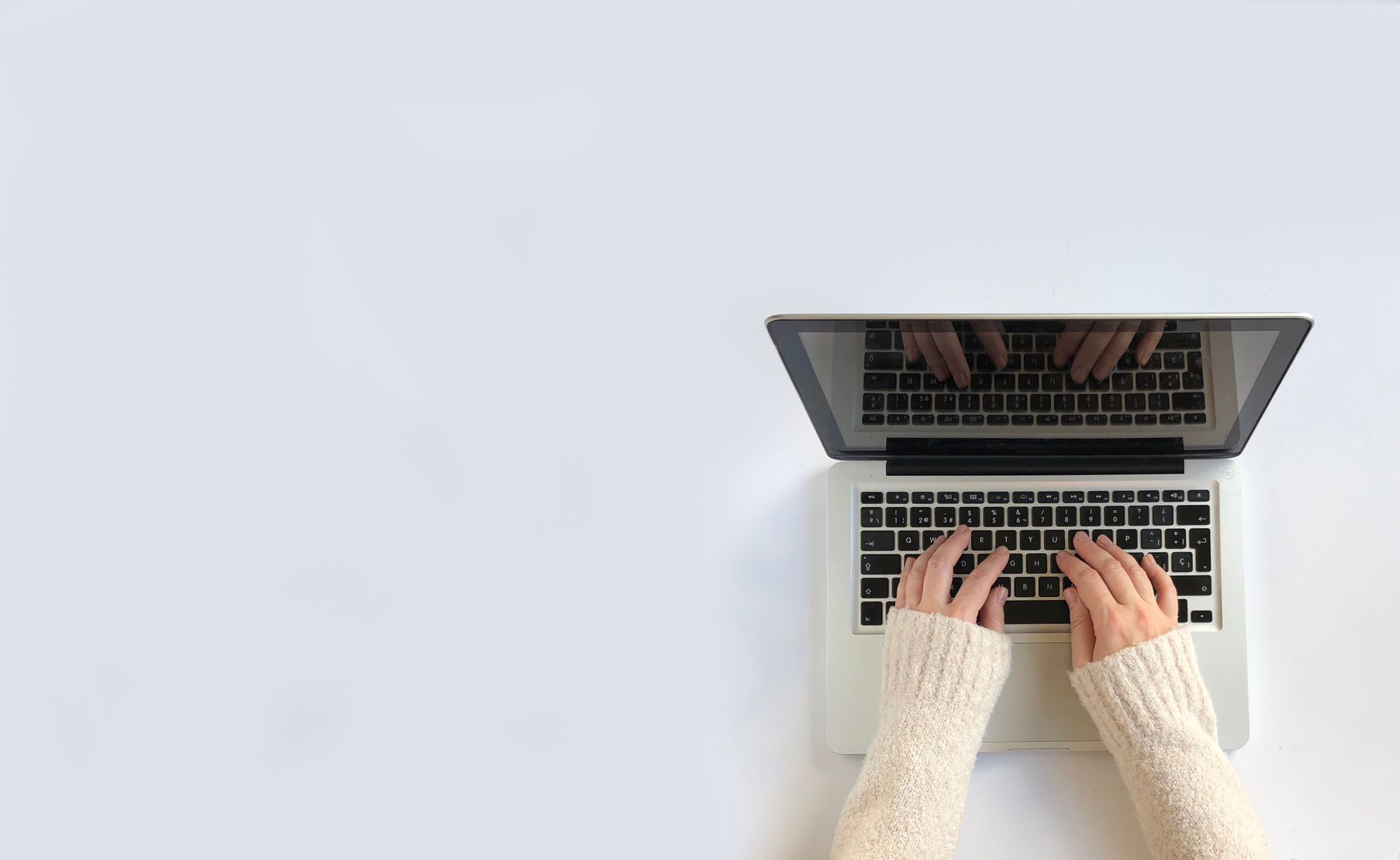 Woman typing on laptop. White Background